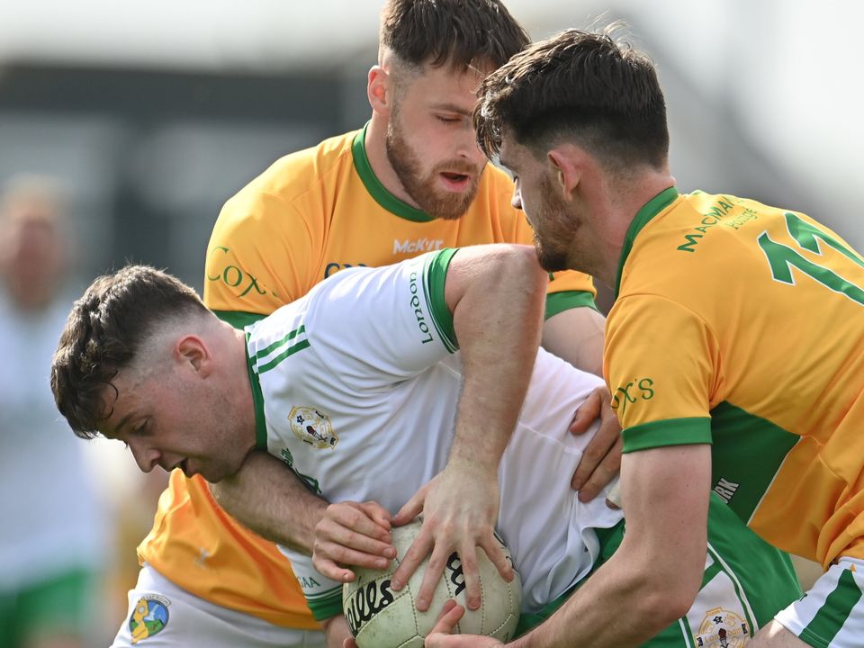 Nathan McElwaine of London in action against Conor Reynolds, left, and Mark Plunkett of Leitrim at at Ruislip. Photo: Sam Barnes/Sportsfile