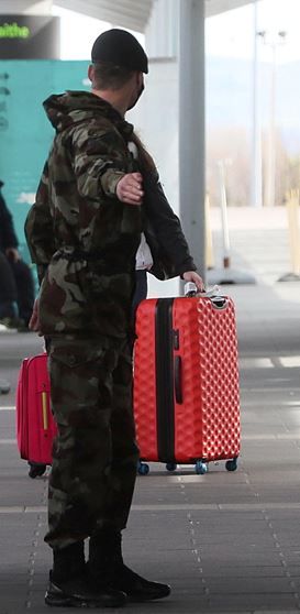 A member of the defence forces directs a passenger arriving at Dublin Airport from one of 33 high risk countries who will be transported to a mandatory 12-day hotel quarantine
Photo: Brian Lawless/PA Wire