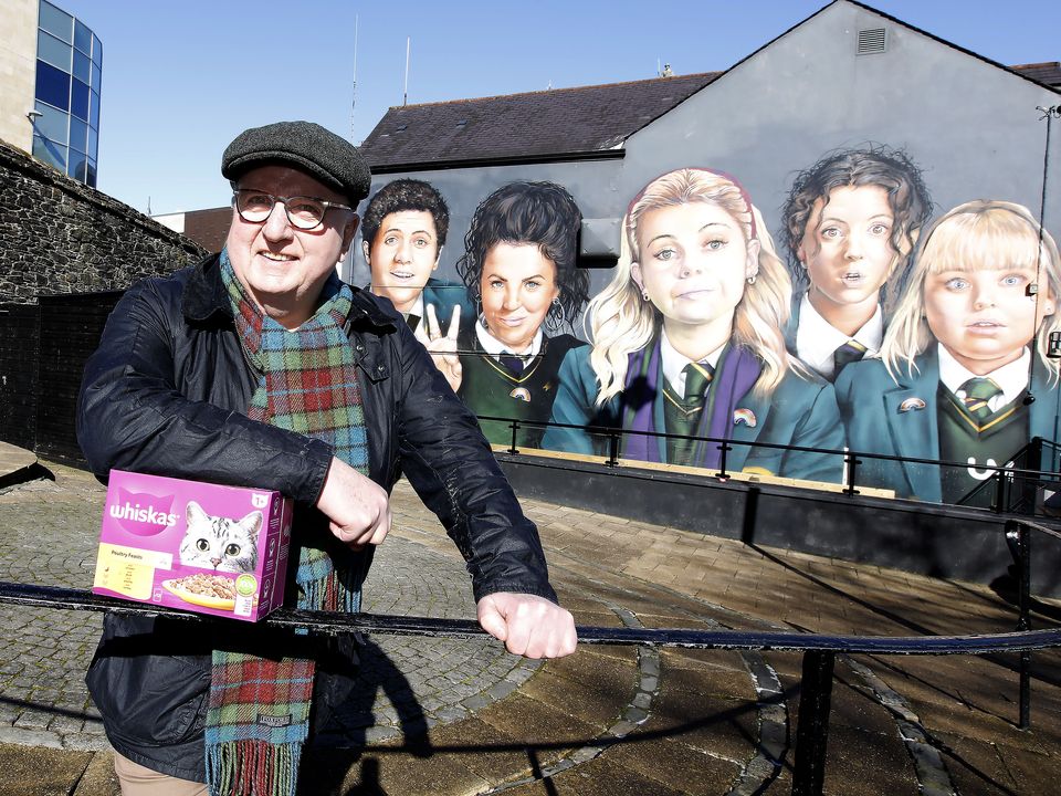 Reporter Hugh Jordan pictured in Derry this week at the Derry Girls mural