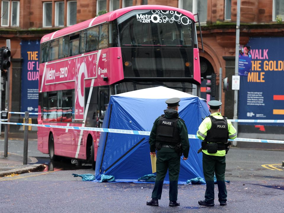 Police officers at the scene of a one-vehicle traffic collision in Belfast city center. Image: Jonathan Porter/Press Eye