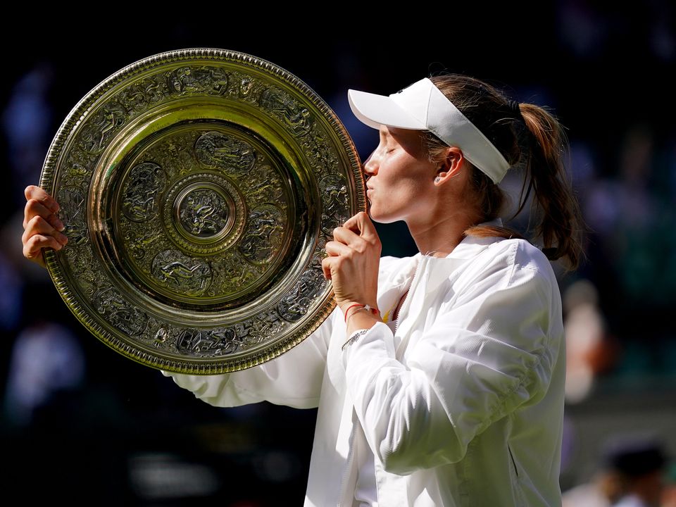 Elena Rybakina celebrates with the The Venus Rosewater Dish following victory over Ons Jabeur in The Final of the Ladies' Singles on day thirteen of the 2022 Wimbledon Championships at the All England Lawn Tennis and Croquet Club, Wimbledon. Picture date: Saturday July 9, 2022.