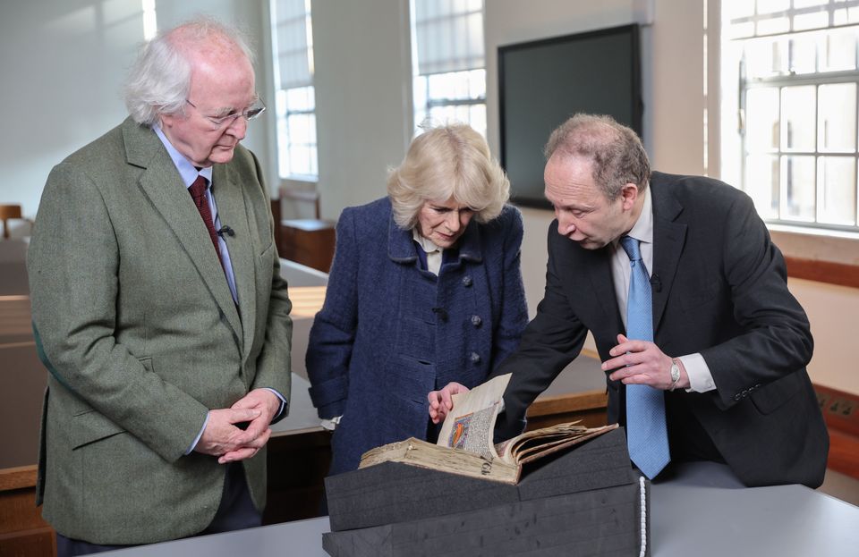 The Duchess of Cornwall and author Sir Philip Pullman (left) are shown the Bodley Bestiary by Dr Martin Kauffmann (Chris Jackson/PA)