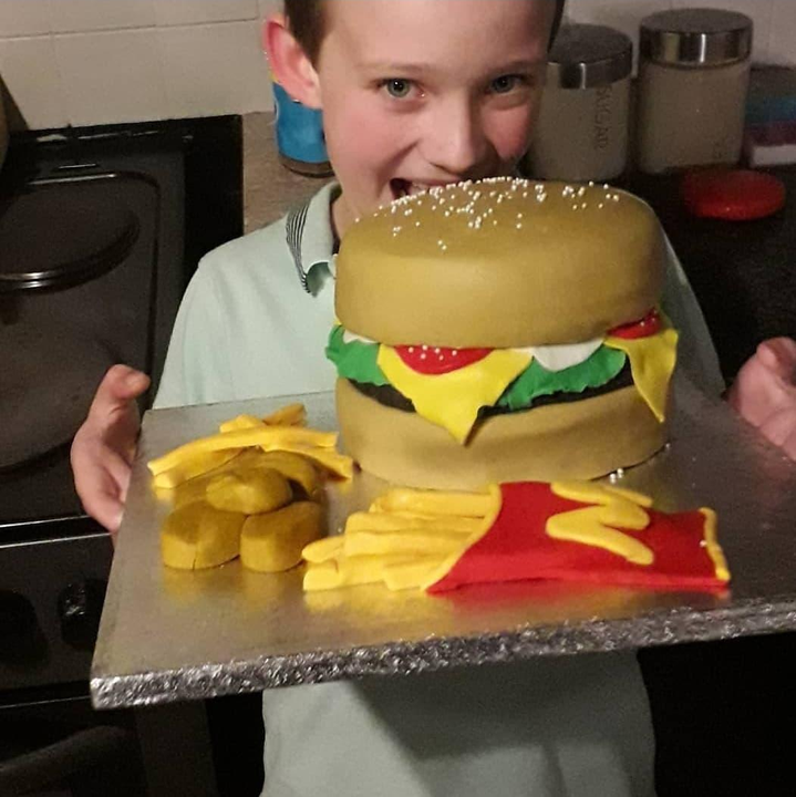 Callum on his sixth birthday with a McDonald's cake