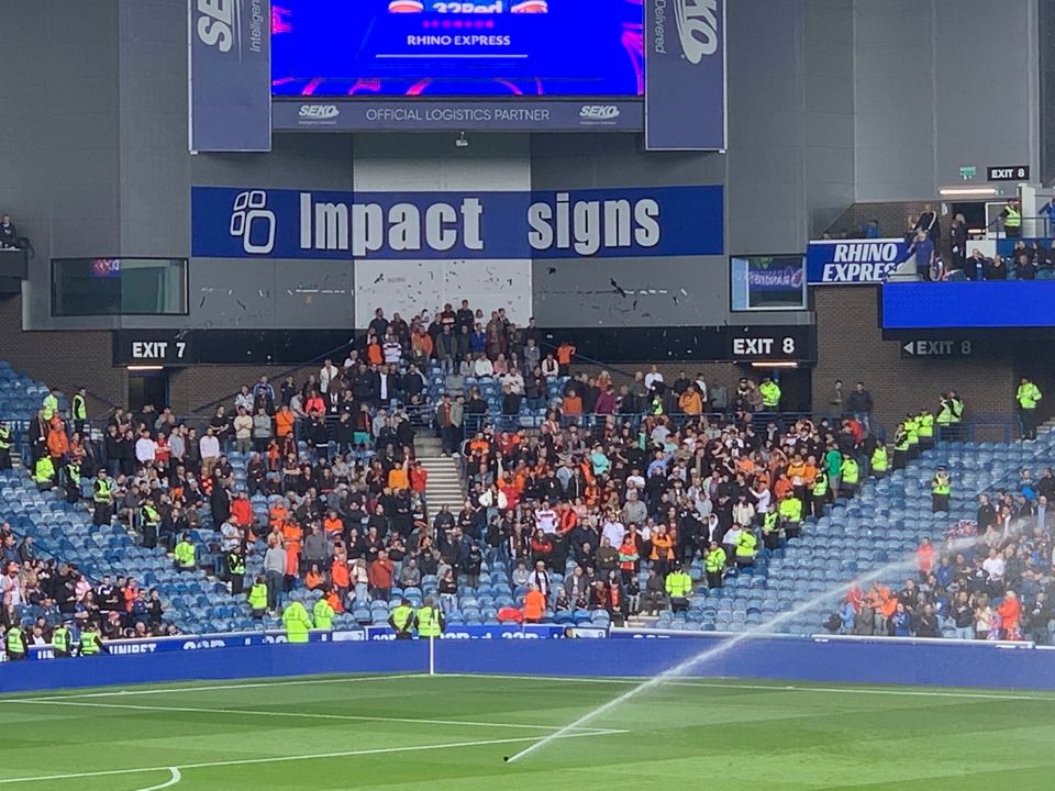 Dundee United fans in the stands during the cinch Premiership match at Ibrox Stadium, Glasgow