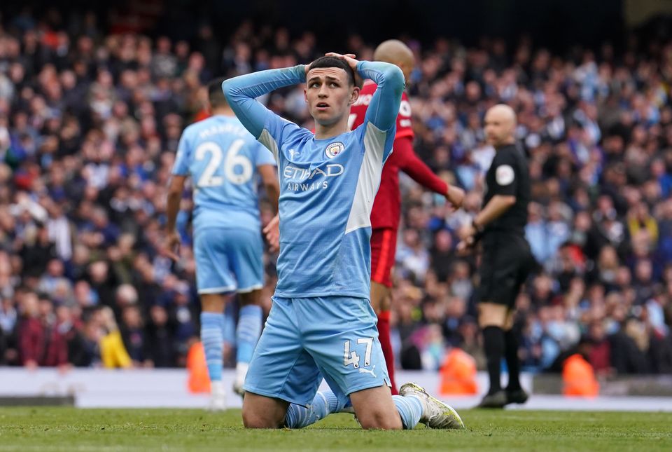 Manchester City’s Phil Foden shows his frustration after Riyad Mahrez missed a late chance against Liverpool (Martin Rickett/PA)