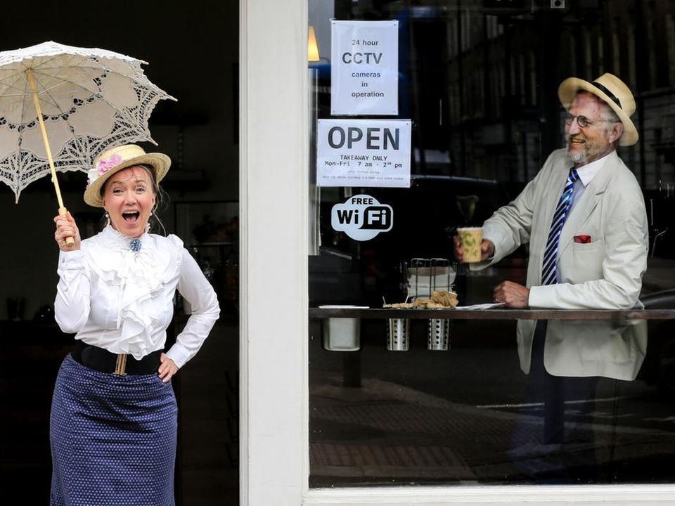 In character: Darina Gallagher plays Molly watched by Tom Fitzgerald during a Bloomsday event on Lincoln Place in Dublin. Photo: Gerry Mooney