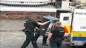Image of the bin being confiscated by the PSNI