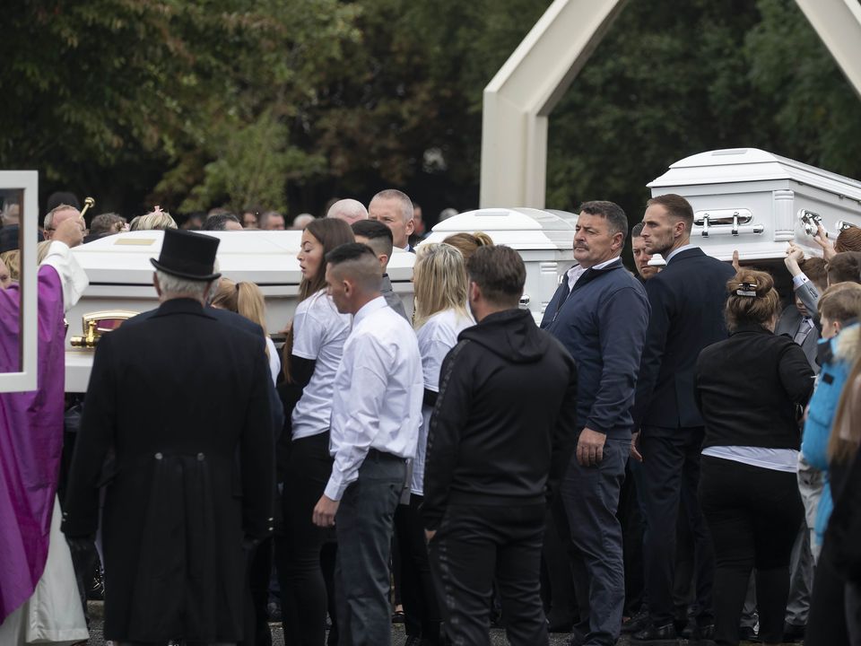 The three white coffins are carried from church after funeral Mass. Photo: Colin Keegan, Collins Dublin