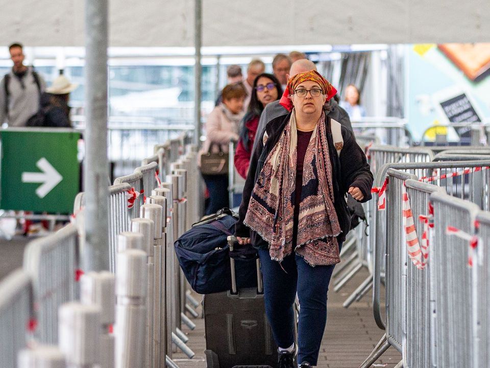 Passengers arrive at Dublin airport on Friday morning (Damien Storan/PA)
