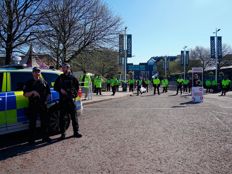 Police gather at the gates of Aintree. Photo: Peter Byrne/PA Wire