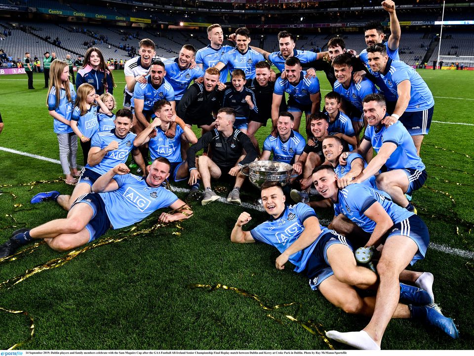Dublin players and family members celebrate with the Sam Maguire Cup after their 2019 success against Kerry. Photo: Ray McManus/Sportsfile