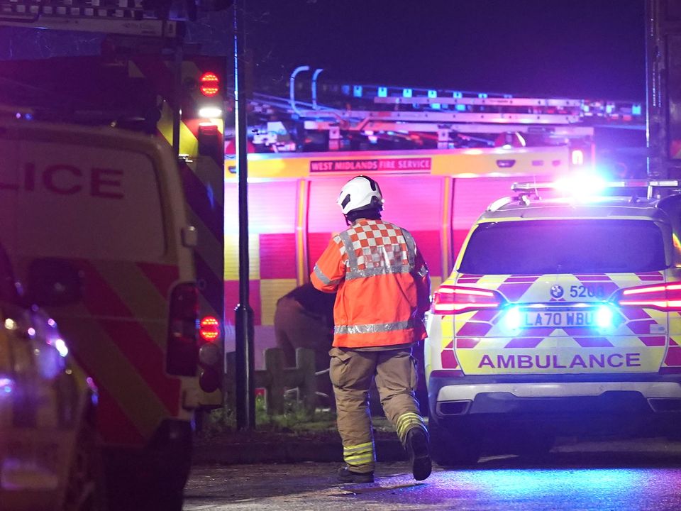 Emergency personnel at the scene in Babbs Mill Park in Kingshurst, Solihull after a serious incident where several people are believed to be in a critical condition after being pulled from the lake. Picture date: Sunday December 11, 2022.