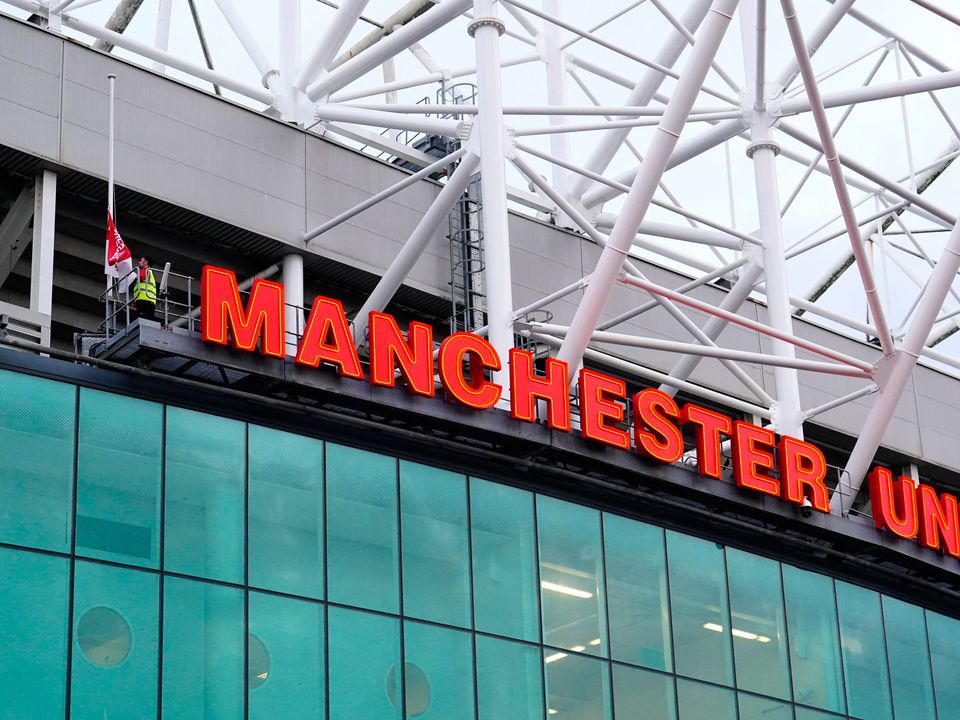 Flags being lowered at Old Trafford during the week. Manchester United have confirmed their Europa League trip to Sheriff Tiraspol will go ahead as scheduled on Thursday. Photo: Martin Rickett/PA Wire