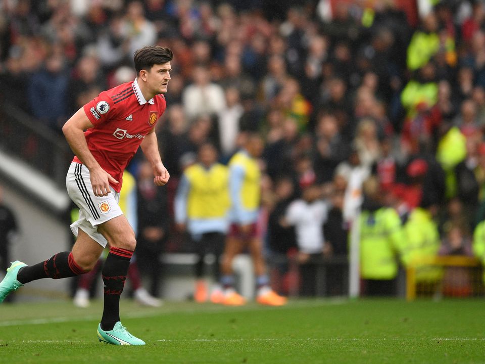 Manchester United's English defender Harry Maguire enters the pitch during the English Premier League football match between Manchester United and Aston Villa at Old Trafford in Manchester, north west England, on April 30, 2023. (Photo by Oli SCARFF / AFP) / RESTRICTED TO EDITORIAL USE. No use with unauthorized audio, video, data, fixture lists, club/league logos or 'live' services. Online in-match use limited to 120 images. An additional 40 images may be used in extra time. No video emulation. Social media in-match use limited to 120 images. An additional 40 images may be used in extra time. No use in betting publications, games or single club/league/player publications. /  (Photo by OLI SCARFF/AFP via Getty Images)