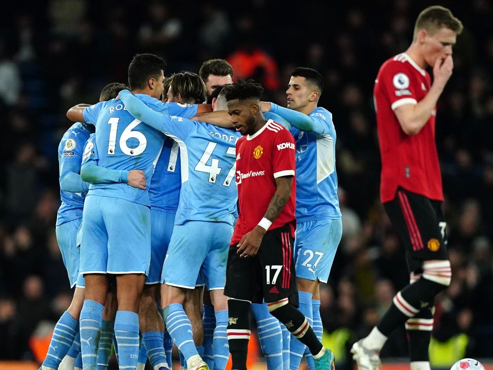 United’s despair is apparent as Manchester City celebrate their fourth goal (Martin Rickett/PA)