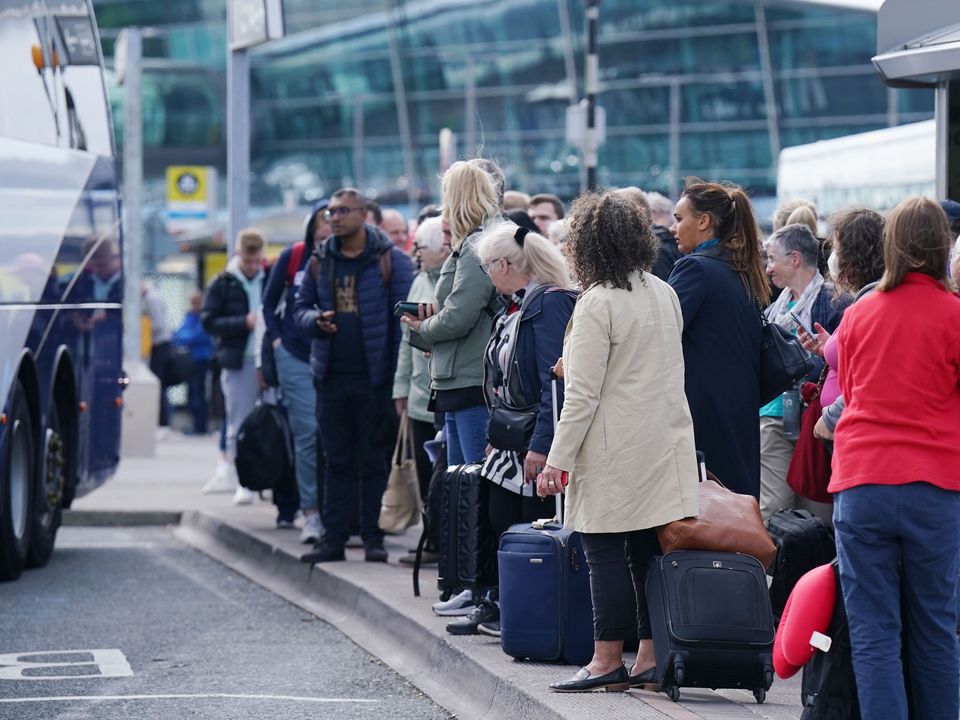 Passengers at Dublin Airport on Tuesday morning (Niall Carson/PA)