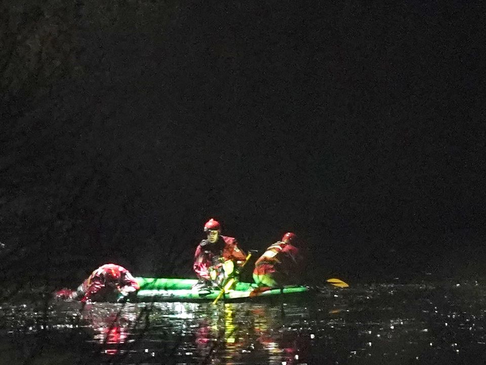 Emergency personnel search the lake at the scene in Babbs Mill Park in Kingshurst, Solihull after a serious incident where several people are believed to be in a critical condition after being pulled from the lake. Picture date: Sunday December 11, 2022.