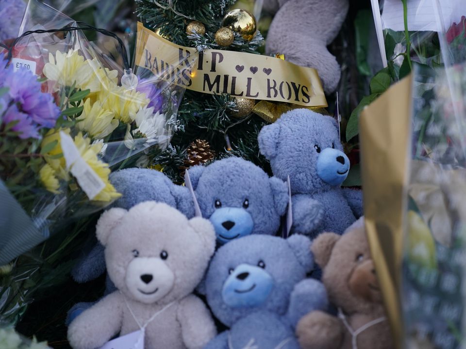 Flowers and tributes near to Babbs Mill Park in Kingshurst, Solihull, after the deaths of three boys aged eight, 10 and 11 who fell through ice into a lake in the West Midlands. Picture date: Tuesday December 13, 2022.