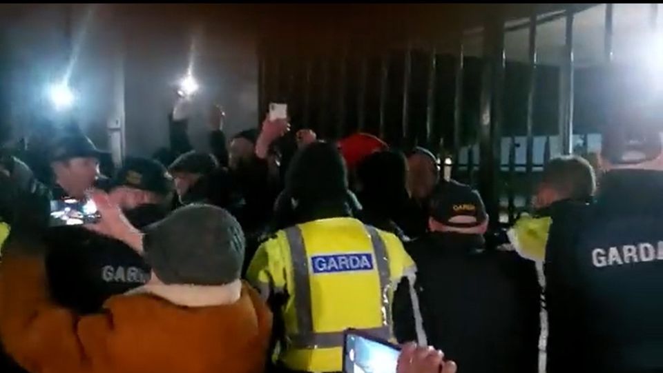 Gardai and protestors at the barracks gates