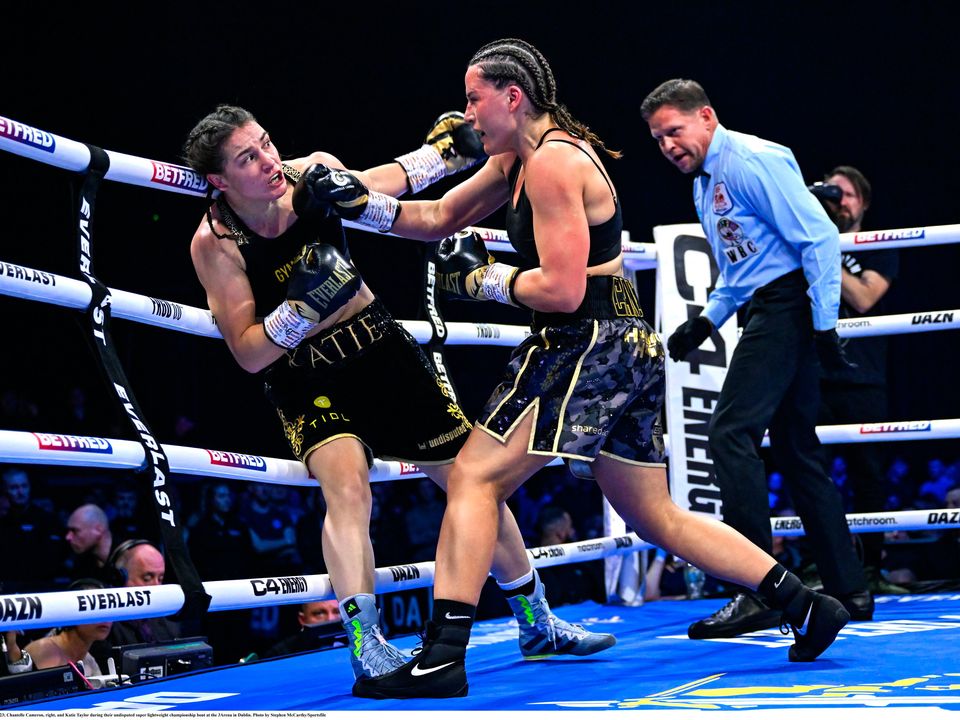 25 November 2023; Chantelle Cameron, right, and Katie Taylor during their undisputed super lightweight championship bout at the 3Arena in Dublin. Photo by Stephen McCarthy/Sportsfile