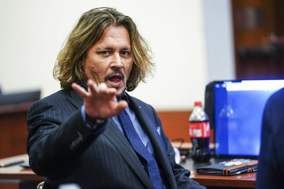 Johnny Depp brought a similar defamation case against the publishers of The Sun newspaper in the UK (Shawn Thew/AP)