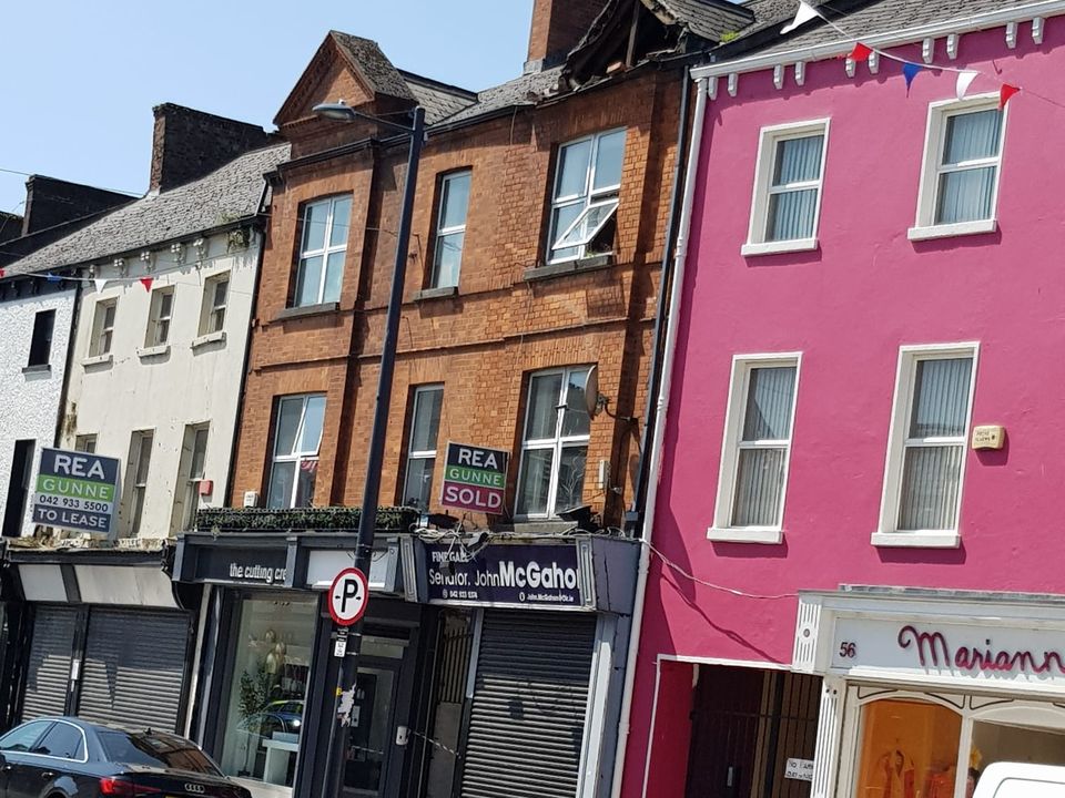 A full image of the scenes shows the damaged roof above Senator John McGahon's office on Clanbrassil Street, Dundalk