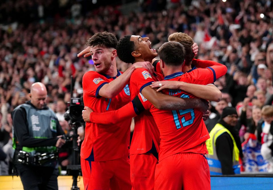 England's Harry Kane celebrates with his team-mates after scoring their side's third goal of the game from the penalty spot during the UEFA Nations League match at Wembley Stadium, London. Picture date: Monday September 26, 2022.