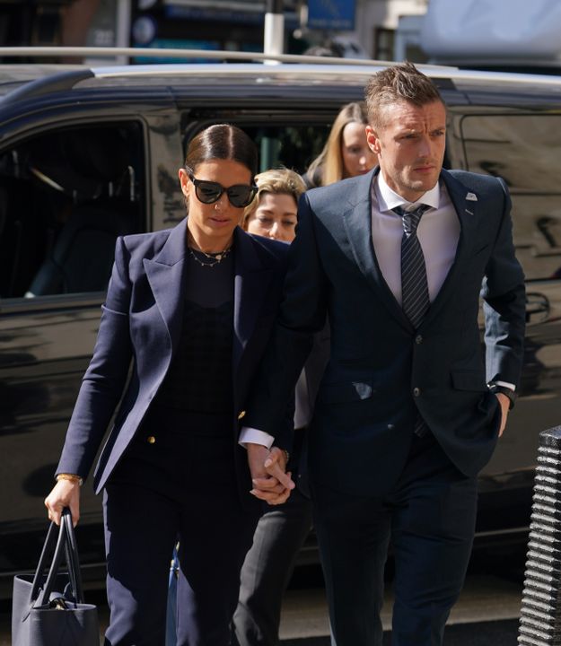 Rebekah and Jamie Vardy arrive at court earlier in the hearing (PA)