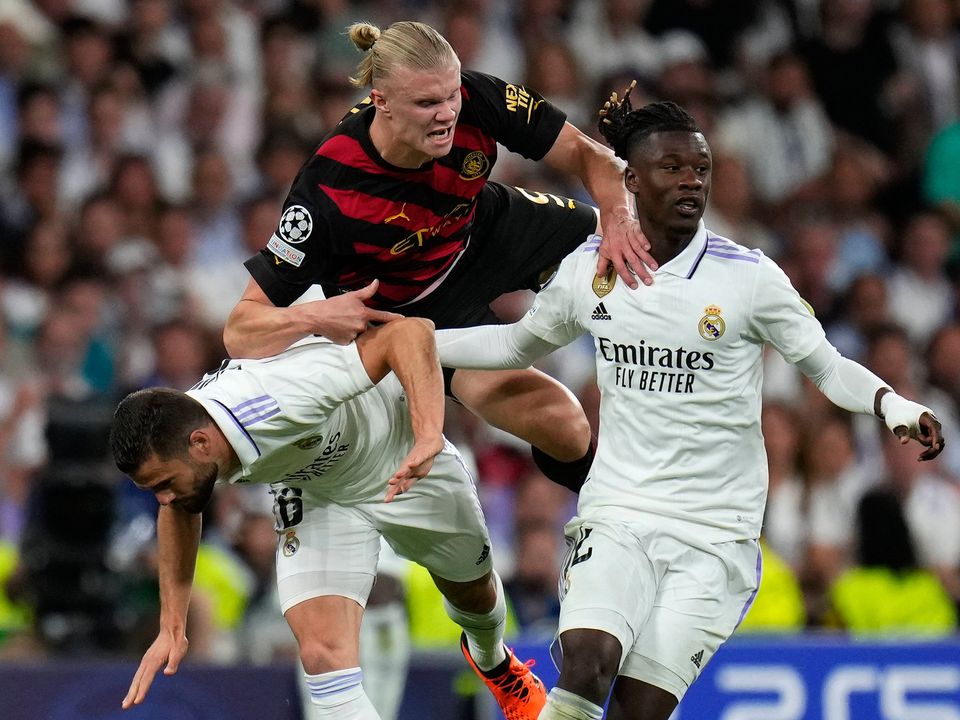 Manchester City's Erling Haaland, top center, is challenged by Real Madrid's Nacho during the Champions League semifinal first leg soccer match between Real Madrid and Manchester City at the Santiago Bernabeu stadium in Madrid, Spain, Tuesday, May 9, 2023. (AP Photo/Manu Fernandez)