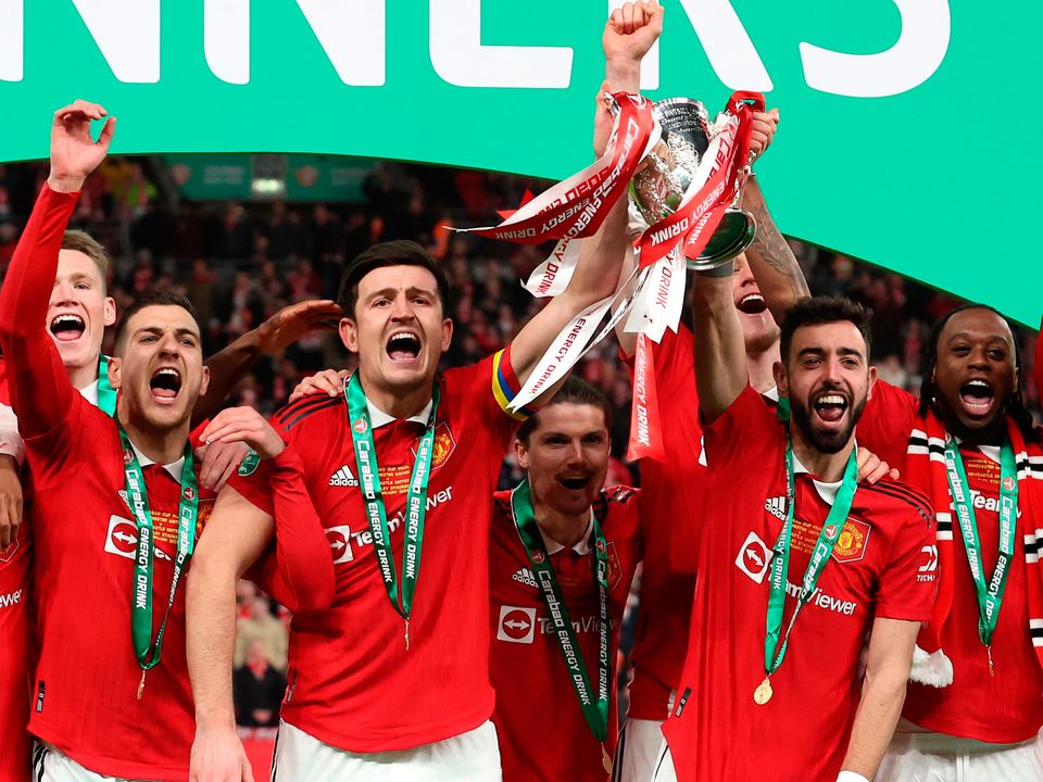 Bruno Fernandes and Harry Maguire of Manchester United lift the Carabao Cup trophy following victory in the Carabao Cup Final match between Manchester United and Newcastle United at Wembley Stadium on February 26, 2023 in London, England. (Photo by Julian Finney/Getty Images)