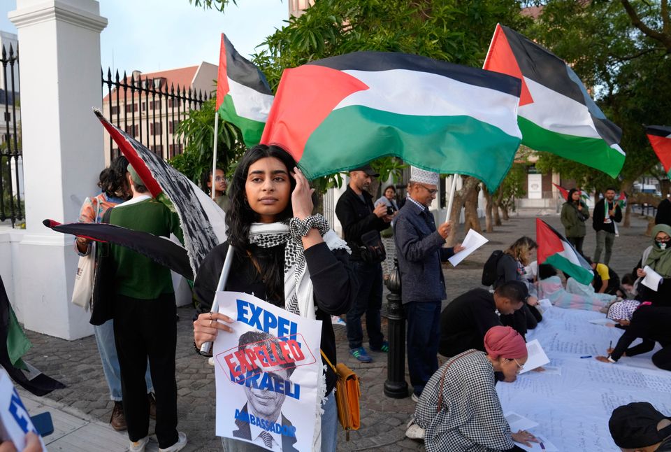 Pro-Palestinian supporters protest outside Parliament in Cape Town, South Africa, Tuesday, Nov. 21, 2023. The majority of MP's voted to close the Israeli embassy in South Africa over the war in Gaza. (AP Photo/Nardus Engelbrecht)