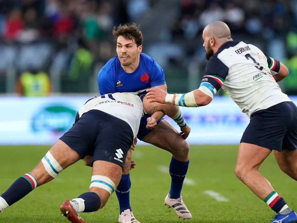 France captain Antoine Dupont is tackled by Italy's Niccolo' Cannone, and teammate Simone Ferrari during their Six Nations clash in Rome last Sunday.