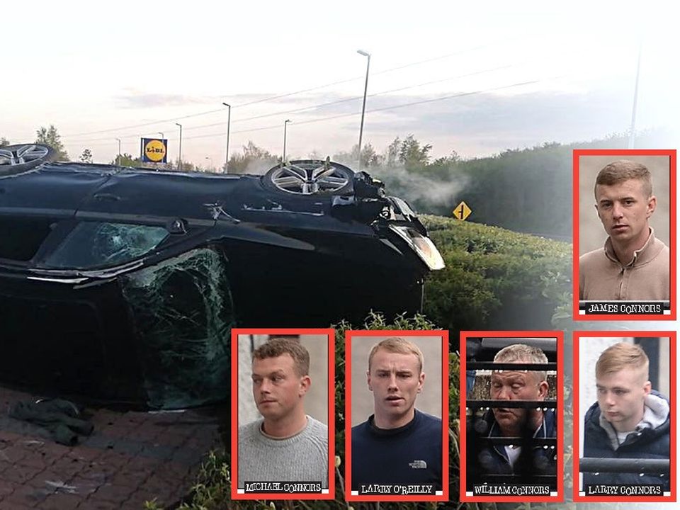The wrecked black Audi after it smashed into roundabout