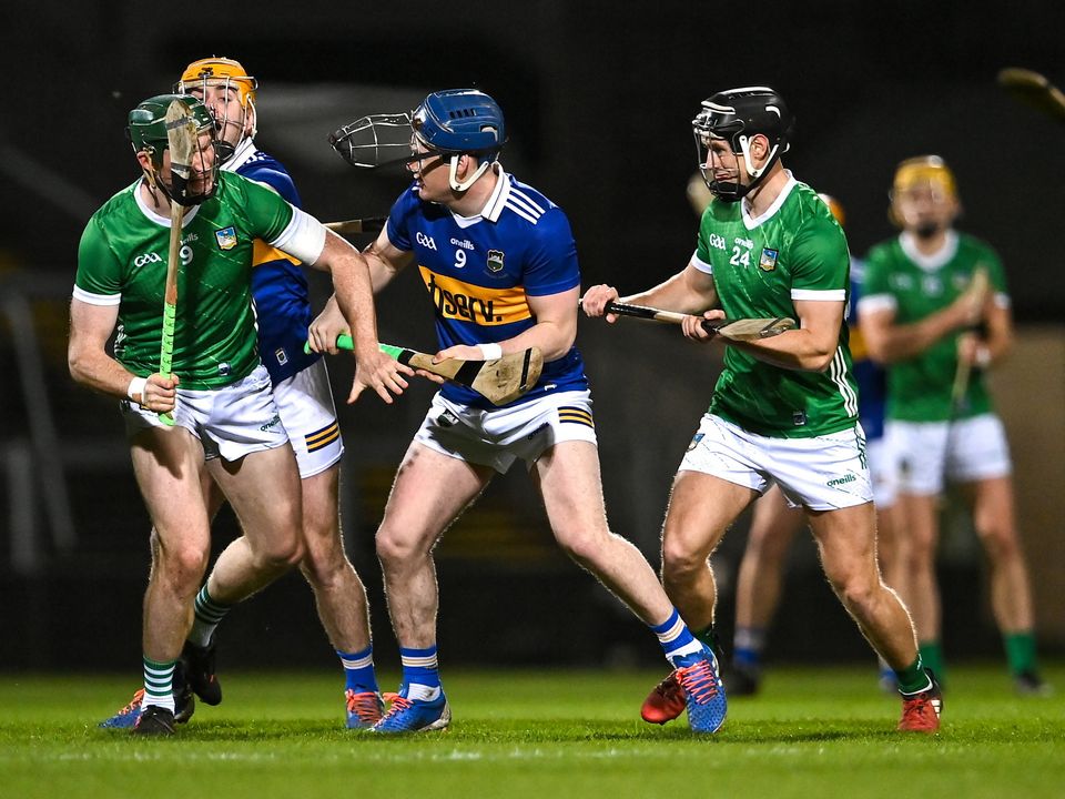 25 March 2023; Players including William O'Donoghue of Limerick, 9, and Alan Tynan of Tipperary, 9, tussle before the throw-in to start the Allianz Hurling League Division 1 Semi-Final match between Limerick and Tipperary at TUS Gaelic Grounds in Limerick. Photo by Piaras Ó Mídheach/Sportsfile