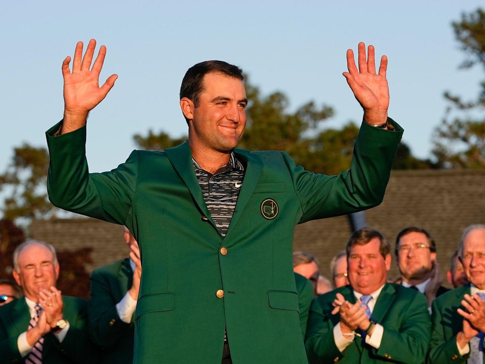 Scottie Scheffler celebrates after putting on the green jacket following his victory at the 86th Masters golf tournament at Augusta National. Photo: AP