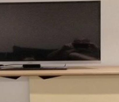Danny Brown took an accidental selfie in his TV screen.