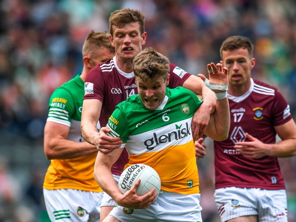 Johnny Moloney of Offaly in action against John Heslin of Westmeath