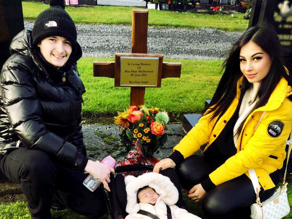 Reita Mallak, her partner and baby daughter Layla visit Mya's graveside in Dardistown cemetery