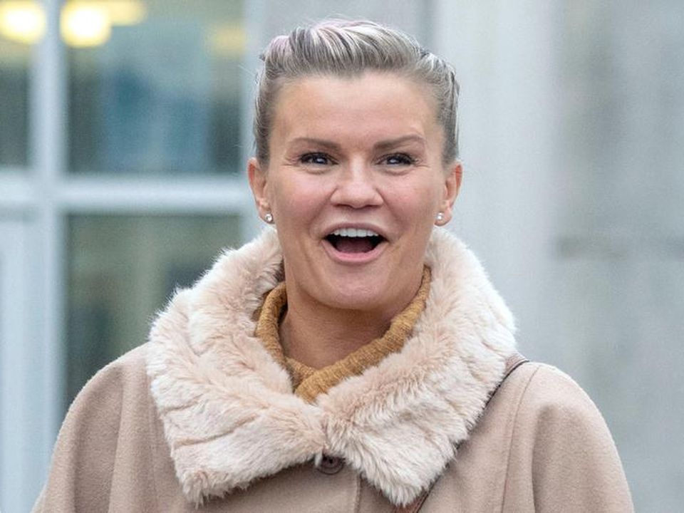 Kerry Katona laughs her head off as her boob pops out of her