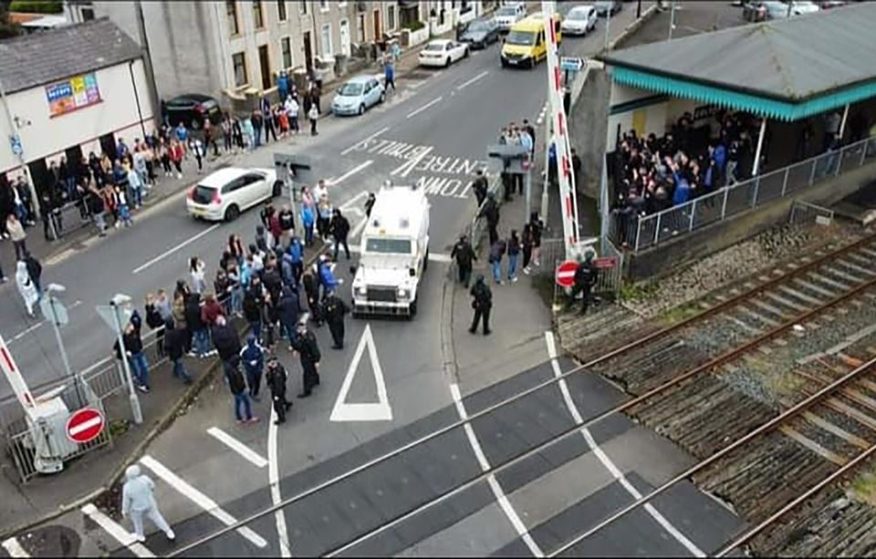 Police separate Linfield and Coleraine fans after a game between the two clubs recently. Coleraine fans (on the left) is believed to have approached the Linfield fans at the Coleraine train station.