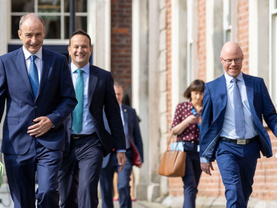 The Taoiseach, Tánaiste and Health Minister arriving at the unveiling of the ‘Living with Covid’ plan in September