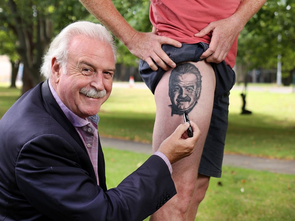 Close pal Marty Whelan with Phil O’Kelly showing off his tattoo tribute