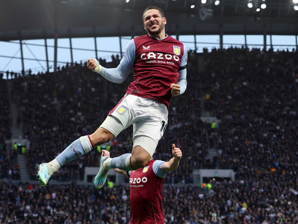 Aston Villa's Emiliano Buendia leaps in the air to celebrate after scoring his side's opening goal. (AP Photo/Ian Walton)
