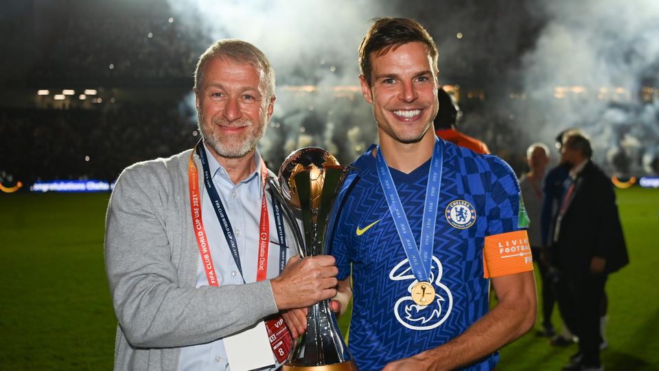 Roman Abramovich and Cesar Azpilicueta pose with the FIFA Club World Cup trophy