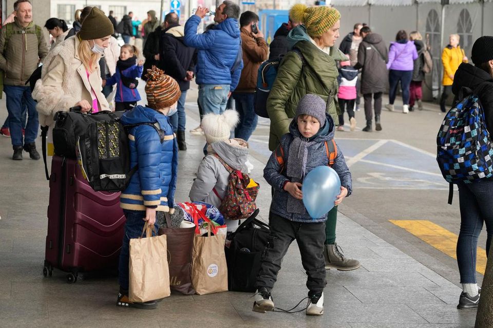 Ukrainian refugees wait for transport at the central train station in Warsaw, Poland earlier this year.