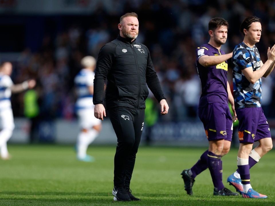 Derby County manager Wayne Rooney reacts following his team's relegation from the Championship match at the Kiyan Prince Foundation Stadium in London on Monday.