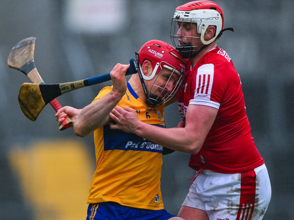 19 March 2023; John Conlon of Clare is tackled by Dáire O’Leary of Cork during the Allianz Hurling League Division 1 Group A match between Clare and Cork at Cusack Park in Ennis, Clare. Photo by Ray McManus/Sportsfile