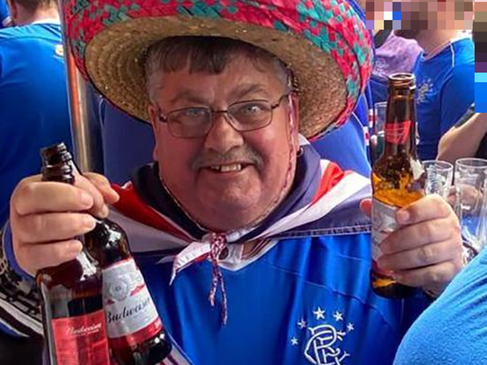 Rangers fan Billy Walker watching the match in Glasgow