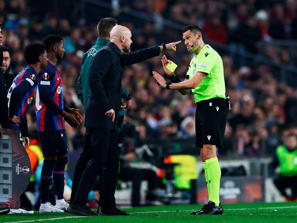 Manchester United manager Erik ten Hag reacts after being shown a yellow card by referee Maurizio Mariani