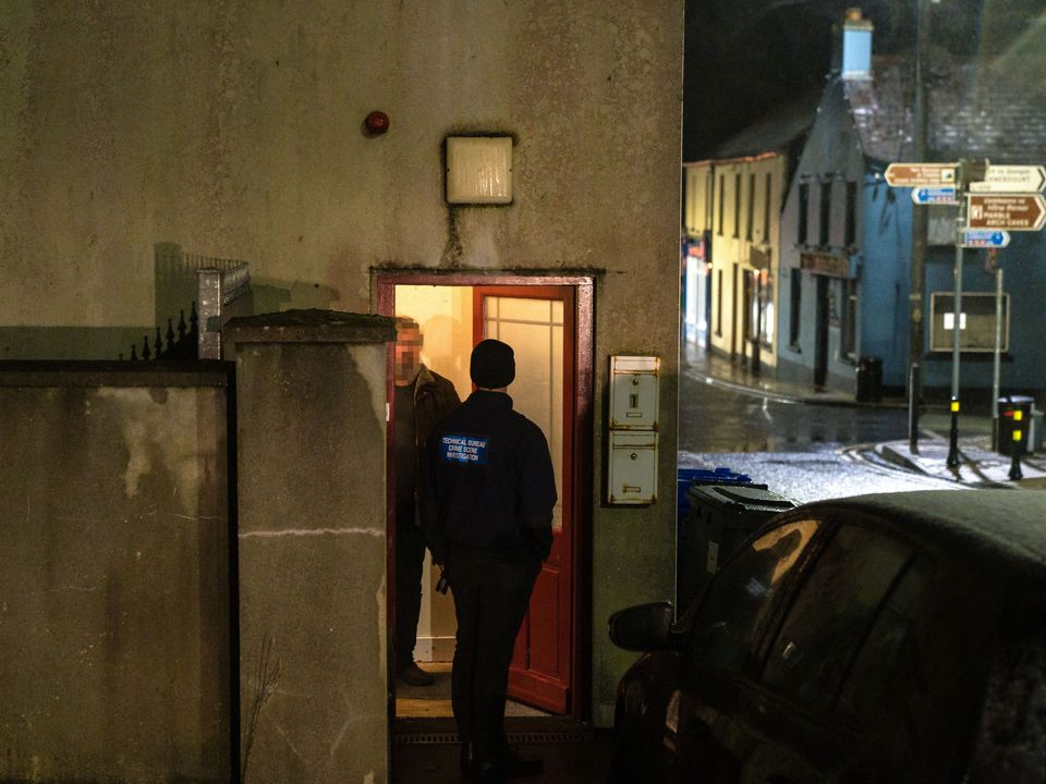 Members of the Garda Technical Bureau at the doorway to a flat  in Blacklion, Co Cavan where a man died on Thursday. Picture: Ronan McGrade